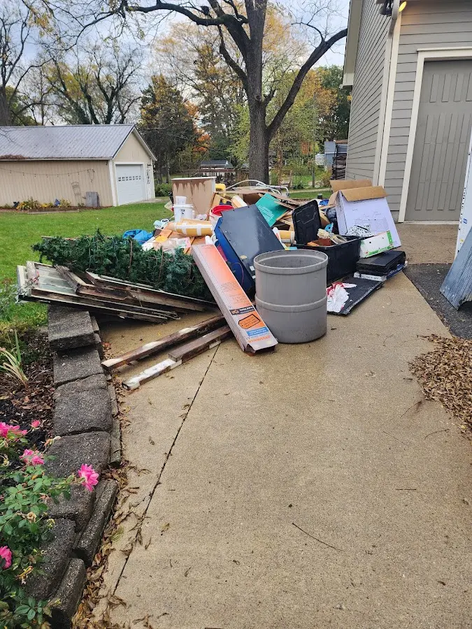 Dumpster being loaded with debris for Estate Cleanout Dumpster Rental in Cheval